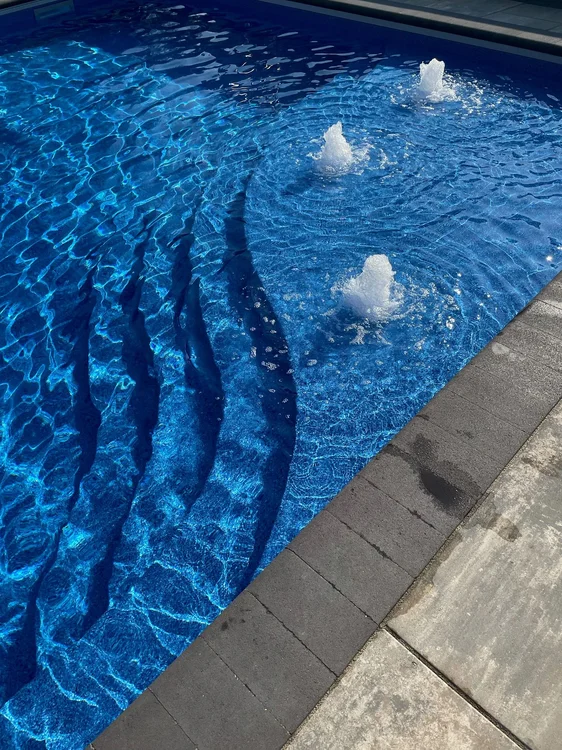 Latham Inground Vinyl Liner Swimming Pool Showcase with custom pattern and crystal clear water in Central MA